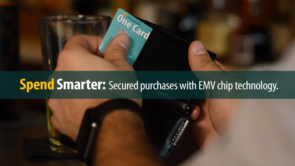 Using a First Source debit card with EMV chip to make purchases.